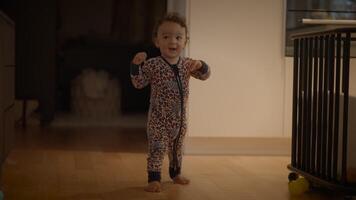 A Joyful Toddler in Colorful Pajamas Exploring Every Corner of the Cozy Home Environment video