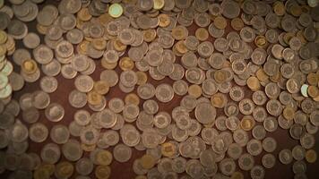 A Variety of Scattered Coins on a Surface A Display of Wealth and Currency Types video