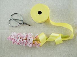 Spring Composition of ribbon, scissors and hyacinth photo
