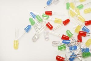 set of multi-colored LEDs. The LEDs are in on a white background. A set of diodes. photo