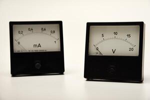 Voltmeter and ammeter on a white background. measuring electric current and voltage. photo