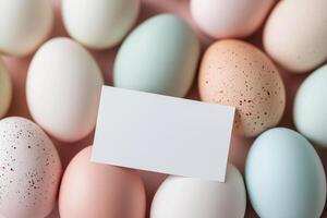Pastel and speckled easter eggs with blank card for custom message photo
