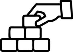 Close up of a hand arranging blocks to form a structure vector
