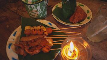 Assorted Grilled Skewers and Snacks on a Rustic Table video