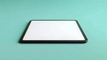 tablet with a blank white screen on a turquoise surface photo