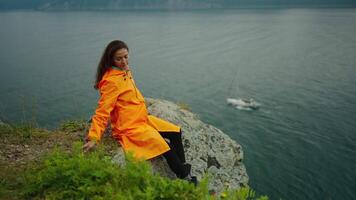 Rest In Nature, Woman Enjoying Calmness And Solitude At Top Of Cliff On Ocean Coastline, Tourism video