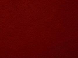 A close up of a red fabric with a rough texture photo