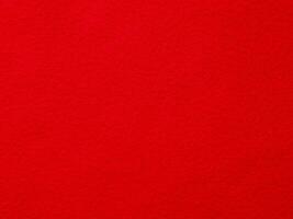 A red background with a red object in the foreground photo