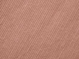A pink fabric with a striped pattern photo