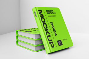A stack of green books with a mockup of a book cover psd