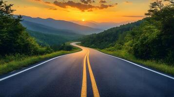 Scenic mountain road curves through rolling hills at sunset, golden sky and dramatic clouds create cinematic landscape with perfect perspective. roaming photo