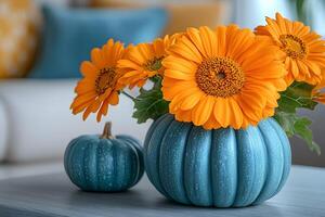 Autumn Decor with Orange Flowers in Blue Pumpkin Vase for Seasonal Home Styling photo