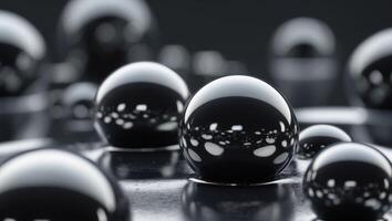 Close up view of glossy black bubbles on a dark surface. photo