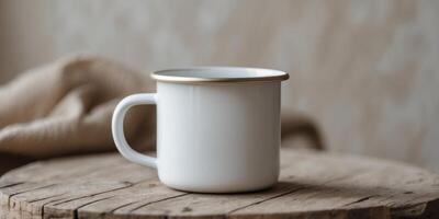 White Enamel Mug on Natural Background with Soft Focus Effects. photo