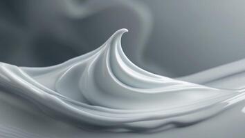 White cosmetic cream spreading on grey background photo
