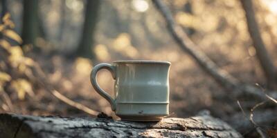 Vintage Mug on Log in Nature with Soft Sunlight in Background photo