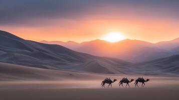 Majestic Camels Silhouette at Sunset in Desert Landscape with Rolling Sand Dunes and Mountains photo