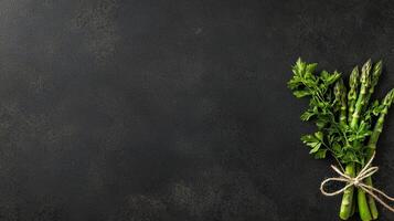 Fresh Green Asparagus Bundle with Parsley on Dark Background Culinary Food Photography photo