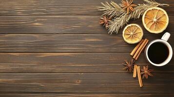 Festive Winter Hot Drink on Dark Wooden Background with Spices and Dried Oranges photo