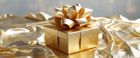 Elegant golden gift box with a luxurious bow atop a sparkling gold background ideal for festive celebrations and special occasions. photo
