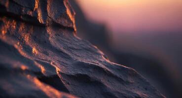 Sunset glow on dark rock wall texture background photo