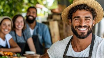 Smiling man with friends enjoying outdoor gathering and food photo