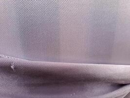 A close up of a purple fabric with a zipper photo