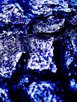 A close up of a rock with a blue background photo