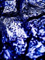 A close up of a rock with a black background photo