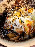 A bowl filled with food on a table photo