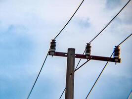 A large electrical pole with wires on it photo