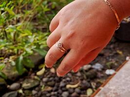A person's hand with a ring on it photo