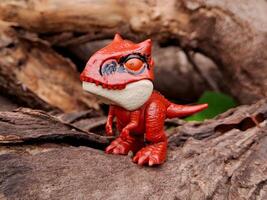 A red toy dinosaur with a big eye photo