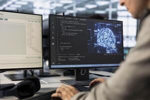 Engineer doing data center automation using AI and machine learning tools. IT professional integrating artificial intelligence driven automation in server farm operations photo