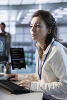 Programmer in server hub facility ensuring compliance with industry standards and regulatory requirements. Data center IT specialist conducting security audits to protect against phishing attacks photo
