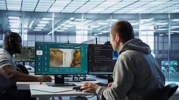 Engineer in server hub making generative artificial intelligence website generating videos using diffusion model algorithms. Employee coding AI virtual assistant producing clips, camera B photo