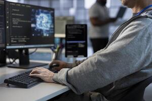Programmer using artificial intelligence technology to optimize data center performance, close up. Man in server hub using AI tech to streamline operations and accurately forecast vulnerabilities photo