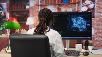 Admin writing code on computer and doing maintenance on artificial intelligence neural networks computerized model. Tech support expert typing on keyboard, doing checkup on AI systems, camera B photo