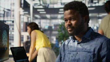 Man doing data entry, typing on keyboard on PC, solving tasks. Close up of office clerk in workspace making sure documents are compliant with quality assurance expectations and standards, camera B photo
