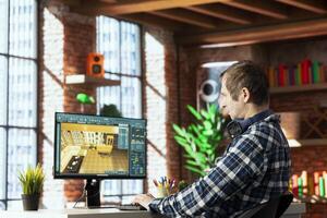 Interior designer working from home uses architectural app on computer to help customers with remodeling job commission. Remote worker at home preparing final architectural preview for clients on PC photo