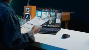 African american teleworker working for diverse company doing business meeting videocall with Asian manager. Remote employee talking in videoconference with supervisor, presenting graphs, camera A photo