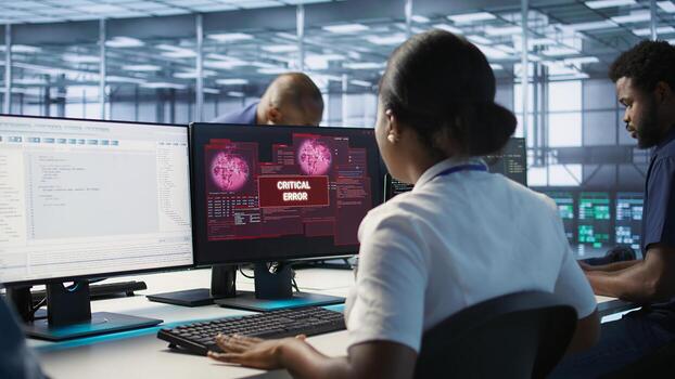 Woman seeing critical error on PC screen in data center, requesting help from cybersecurity team. Employee seeing security incidents affecting server room network system, camera A photo