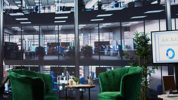 Luxurious office space in a multinational company with a monitor, presenting performance metrics and data analysis on a TV screen. Modern workspace in a corporation used for meetings. photo
