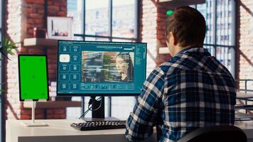 Man looking at tutorial on green screen tablet to learn how to use text to generative models. Man in home office watching guide on mockup device about AI program, camera B photo