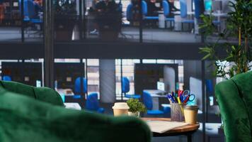 Empty office space showcases a monitor with financial data during meetings, running detailed infographics in a high end decorated workspace. Develop business strategies for success. photo