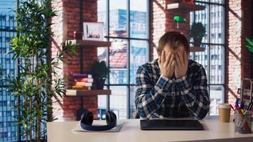 Manager calls employee remotely using internet videocall to offer negative feedback on project progress. Angry team leader berating teleworker at home in teleconference meeting, camera A photo