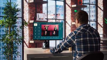 Man in apartment workspace using AI software turning text prompt into photos. Person in brick wall home uses text to image artificial intelligence generative models on computer, camera A photo