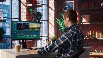 editor analyzing film montage on computer screen before editing color grading and lighting in creative home office. Post production studio employee working with raw footage on PC, camera A photo
