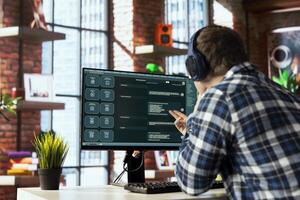 Person listening music uses large language model chatbot engaging in humanlike interactions. Man wearing headphones solves tasks with artificial intelligence LLM handling user requests photo