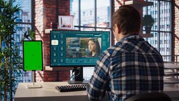 Man looking at tutorial on green screen tablet to learn how to use text to generative models. Man in home office watching guide on mockup device about AI program, camera A photo